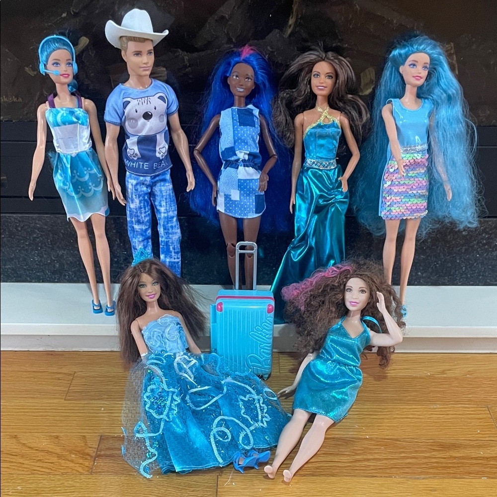 collection of diverse Barbie fashion dolls and accessories